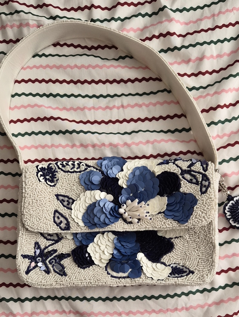 Embellished White Shoulder Bag with Blue Floral Appliqué